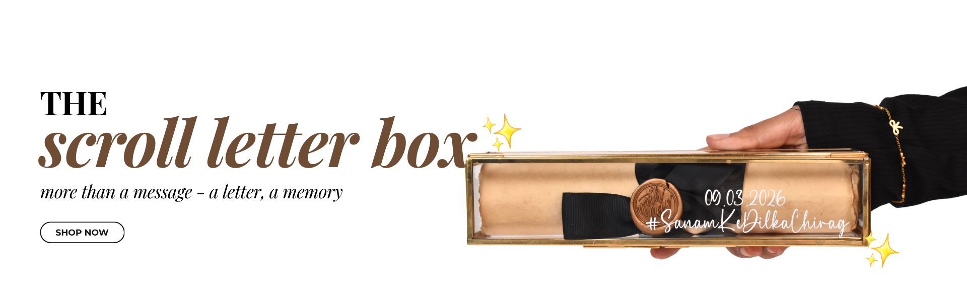 Hand holding a scroll letter box with text and a 'Shop Now' button.slider_item_ch4nxn